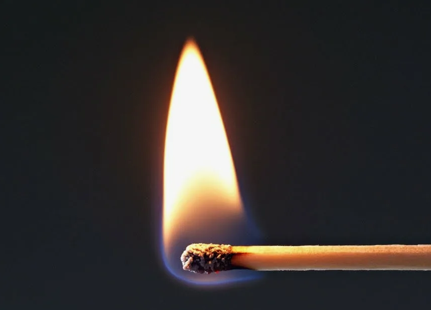 Sulphur or sulfur safety match being ignited and burning